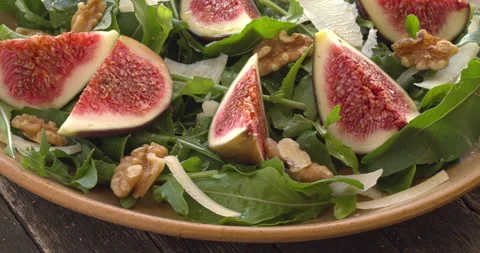 Arugula and fig salad. Vertical video. Stock Footage 308076626