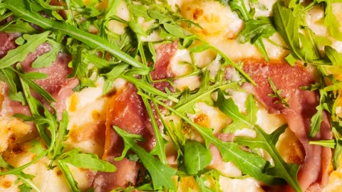 Arugula and Prosciutto Pizza texture Stock Footage 333205206