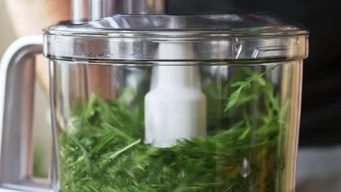 Arugula being chopped in a food processor Stock Footage 72466859