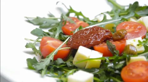 Arugula with cheese and tomatoes Stock Footage 46293853