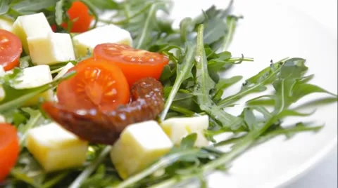 Arugula with cheese and tomatoes Stock Footage 46293858