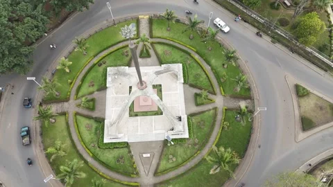 ARUSHA BY DAY, FLAME OF INDEPENDANCE AND CITY FULL PANORAMA DRONE 4K Stock Footage 289524435