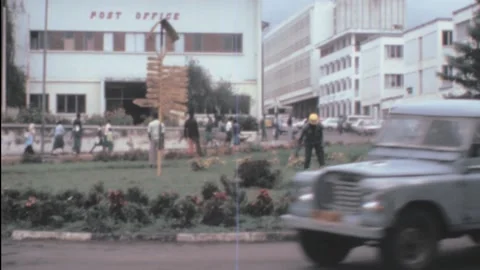 Arusha, Tanzania - 1983: man work in a roundabout as gardener Stock Footage 159643267