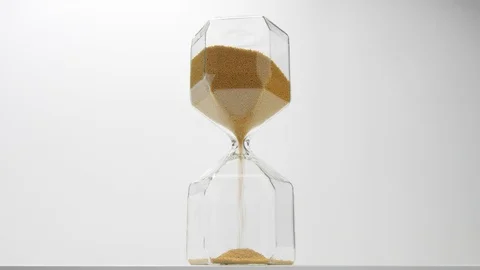 Asand clock low point in studio. Minimalistic footage time deadline concept Stock Footage 116334345