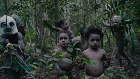Asaro Mudmen Warrior Walking Through Jungle With Children Papua New Guinea Stock Footage 330422464