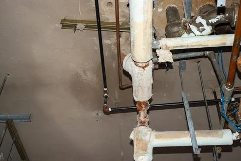 Asbestos pipe insulation above ceiling. Stock Photos