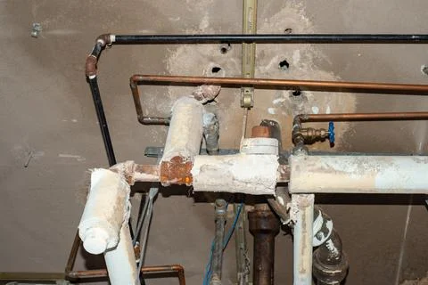 Asbestos pipe insulation above ceiling. Stock Photos