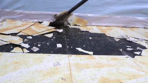 Asbestos vynil floor tile removal. Stock Footage 255624197