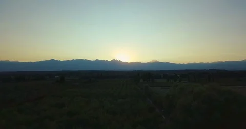 Ascending Aerial Flight over fields towards Cordillera de los Andes Stock-Footage 128849507