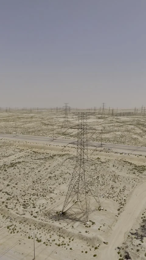 Ascending Aerial View of High-Voltage Power Lines in Al Ahsa, Saudi Arabia Stock Footage 340484396
