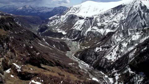 Ascending aerial view of massive gorge in Gudauri Stock Footage 224482870
