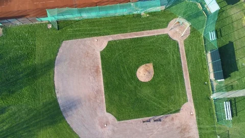 Ascending and rotating overhead view of green beautiful baseball field in 스톡 동영상 106190414