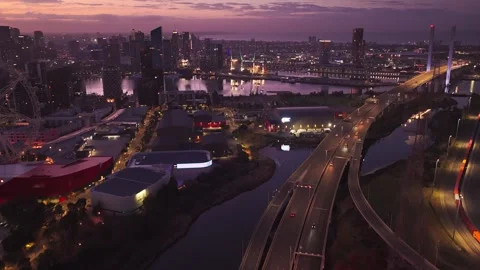 Ascending Dawn Drone Flight Toward Docklands and Bolte Bridge Melbourne Stock Footage 325421377