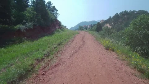 Ascending the dirt road Stock Footage 84956662