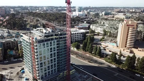 Ascending drone at the end of long crane boom Stock Footage 84948720