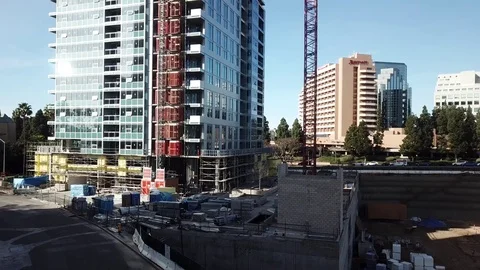 Ascending drone flies from ground to top of crane Stock Footage 85371404