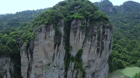 Ascending Drone Over Cliff Mountain and River Valley Zhejiang China Stock Footage 330457644