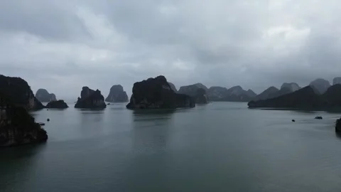 Ascending Drone Rising Shot Over Dramatic Overcast Ha Long Bay Stock Footage 330061539