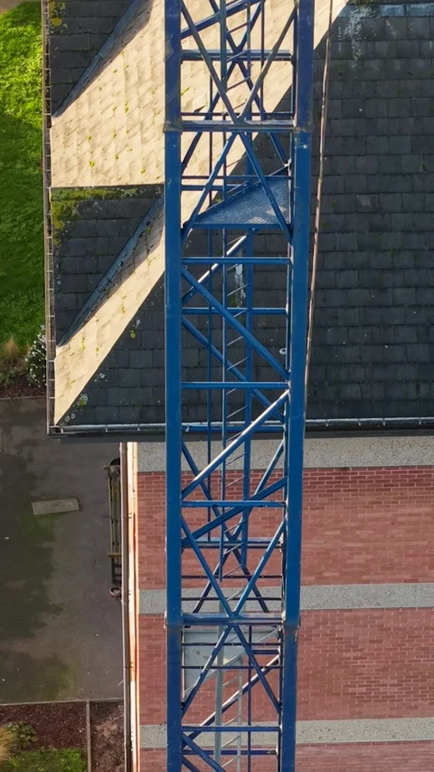 Ascending Drone Shot Along Construction Crane from Ground Level to Hook Over Stock Footage 324842495