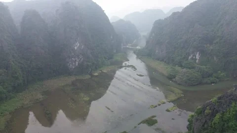 Ascending Drone Shot of Karst Mountains and River Valley in Ninh Binh, Vietnam Stock Footage 330061540