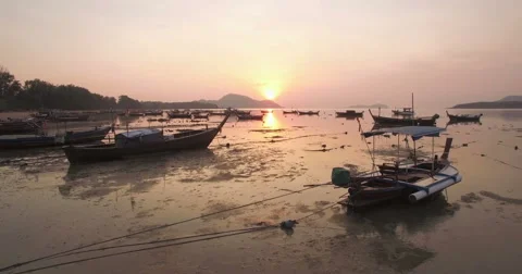 Ascending Drone Shot of Sunset Over Thai Long-tail Boats in Phuket Thailand 스톡 동영상 64932666