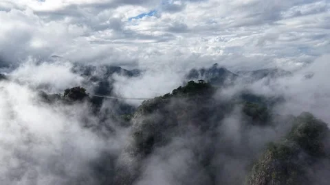 Ascending Drone Shot of Suspension Bridge and Sea of Clouds, South Korea Stock Footage 345867462