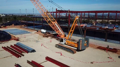Ascending drone shows side of large yellow crane Stock Footage 85371259