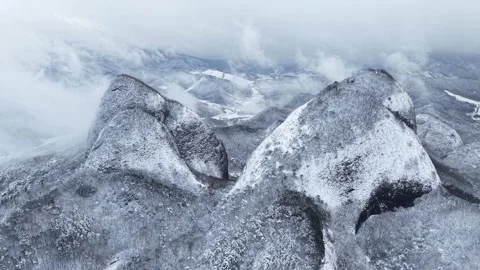 Ascending Drone View Pulling Away from Snow-Covered Maisan Mountain, South Korea Stock Footage 344248223