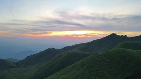 Ascending Drone View of Sunrise Over Alpine Meadow Wugong Mountain China Video stock 330286052