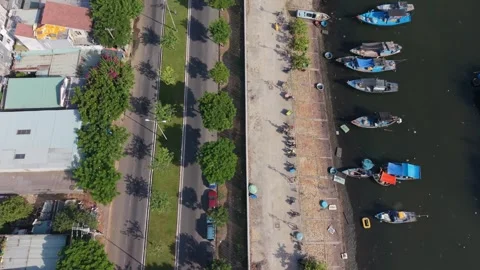 Ascending Drone View of Waterfront Road and Fishing Boats in Da Nang Stock Footage 340199076