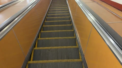 Ascending escalator moves upward through station Stock Footage 345238147