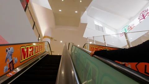 Ascending Escalator Past MR DIY Ad in AEON Mall Stock Footage 345939904