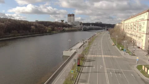 Ascending forward drone view over river and city avenue Video stock 323166407