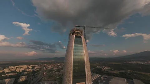 Ascending FPV drone flight above modern skyscraper rooftop in Sofia, Bulgaria. Stock Footage 340270156
