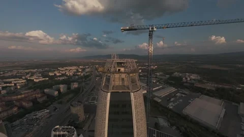 Ascending FPV drone flight above modern skyscraper rooftop in Sofia, Bulgaria. Stock Footage 340270269
