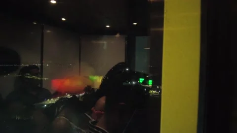 Ascending Outdoor Elevator At Night Viewing City With Reflection Of People Video stock 225620331