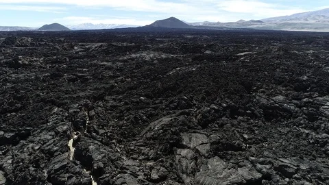 Ascending over black bed of lava general view of volcanos. Volcanic landscape 스톡 동영상 103479689