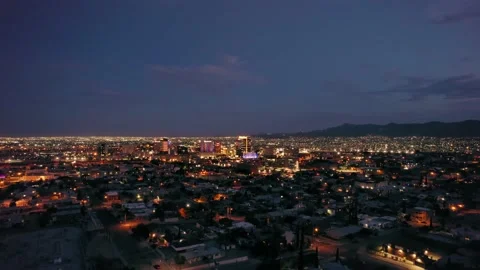 Ascending over El Paso at night with Juarez in the Background Stock Footage 202003431
