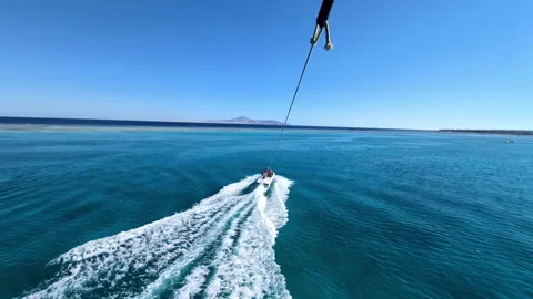 Ascending with a parachute, experiencing a breathtaking firsthand Stockbeeldmateriaal 265454422