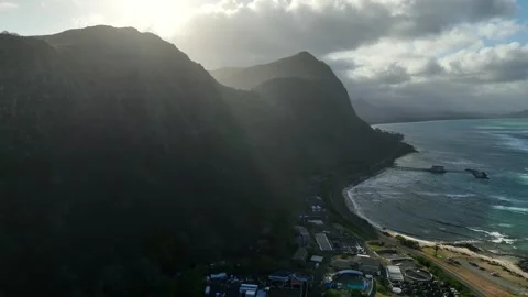 Ascending Pull Back From Backlit Coastal Cliffs As Sun Rays Pierce Clouds Stock Footage 342652373