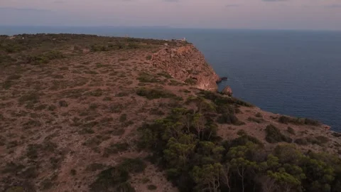 Ascending Pull-Up Cap Blanc Lighthouse — Mallorca, Majorca 4K, travel, adventure Stock Footage 315369934