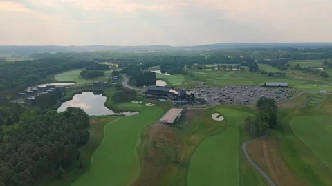 Ascending Pullback Drone Shot Of Fairways And Clubhouses At TPC Toronto Osprey Stock Footage 328571111