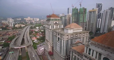 Ascending Pullback Shot of Kuala Lumpur Cityscape and Highway Intersection Stock Footage 72030539