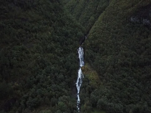Ascending Up-River in front of a Secluded Pristine Waterfall Stock Footage 80990676