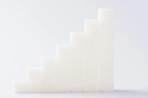 Ascending stacks of sugar cubes graph chart Stock Photos