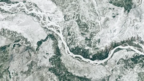 Ascending through falling snow over Alaska's Yukon River, Winter. 2 versions Stock Footage 267031696