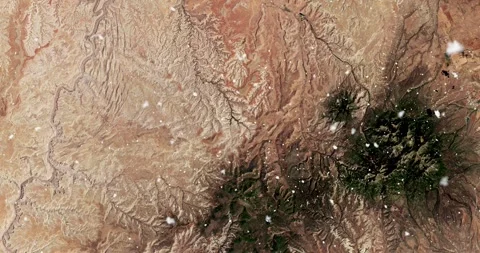 Ascending through falling snow over Canyonlands National Park. Two versions Stock Footage 268299241