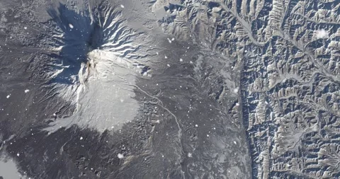 Ascending through falling snow over Kamchatka Peninsula, Russia. Two versions Stock Footage 268299376