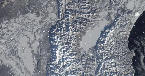 Ascending through falling snow over Kamchatka Peninsula, Russia. Two versions Stock Footage 268299382