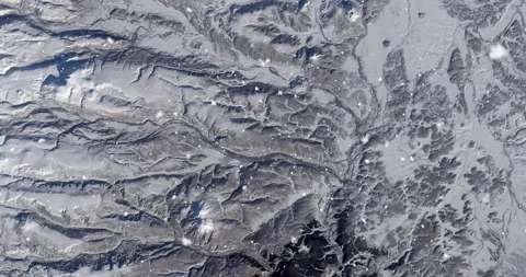 Ascending through falling snow over Kamchatka Peninsula, Russia. Two versions Stock Footage 268303267